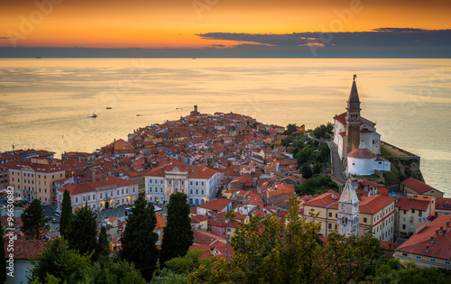 Sunset Over Adriatic Sea and Picturesque Old Town of Piran, Slovenia. Aerial View.