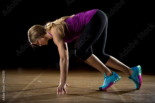 blonde girl in athlete start pose