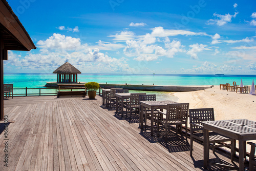 Summer empty outdoor cafe on shore at exotic island in indian ocean
