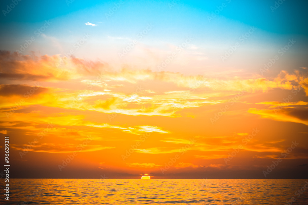 Fototapeta premium Sea waves on the background of beautiful sunset. Toned