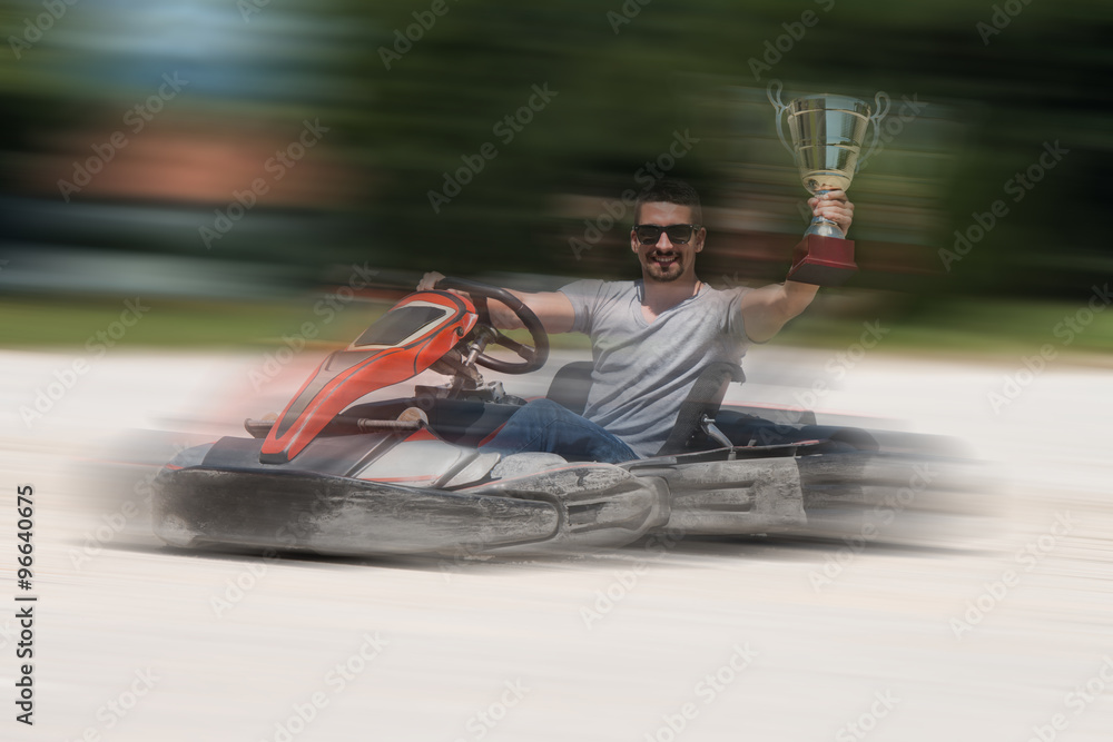Man Is Holding Cup Speed Karting Race