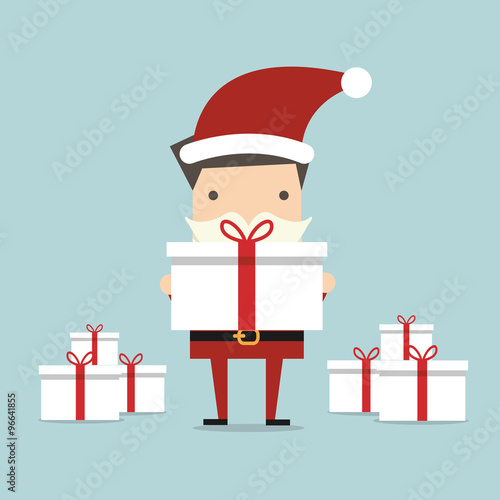 Businessman Santa holding a big gift box photo