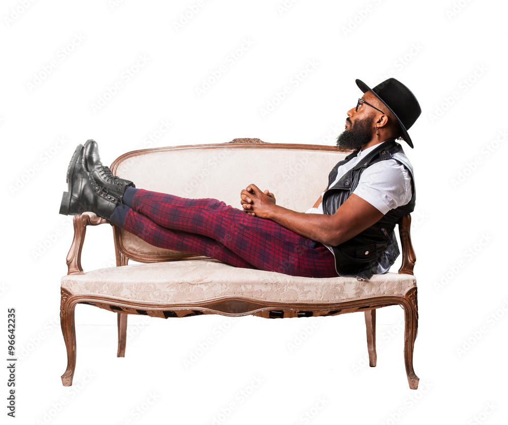 black man sitting on a sofa black man sitting on a sofa
