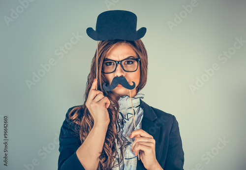 Valokuva Beautiful, pretty young woman holding paper mustache hat