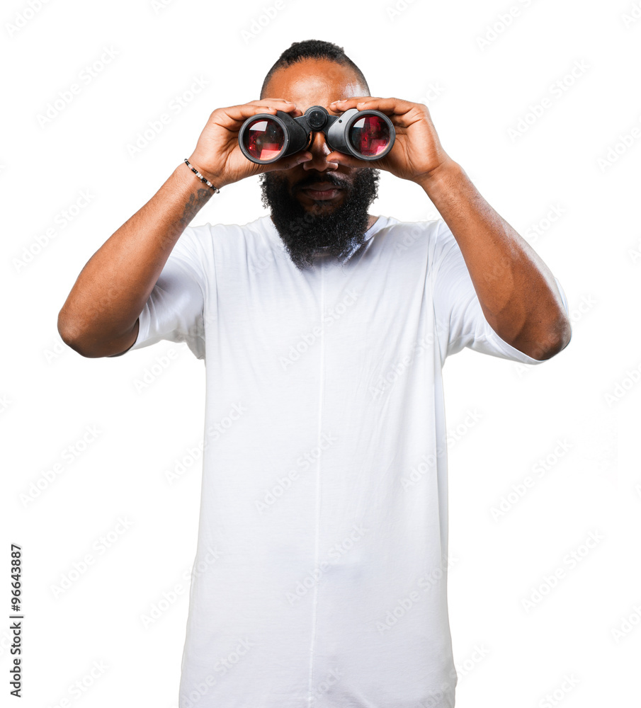 black man looking through a binoculars black man looking through a binoculars
