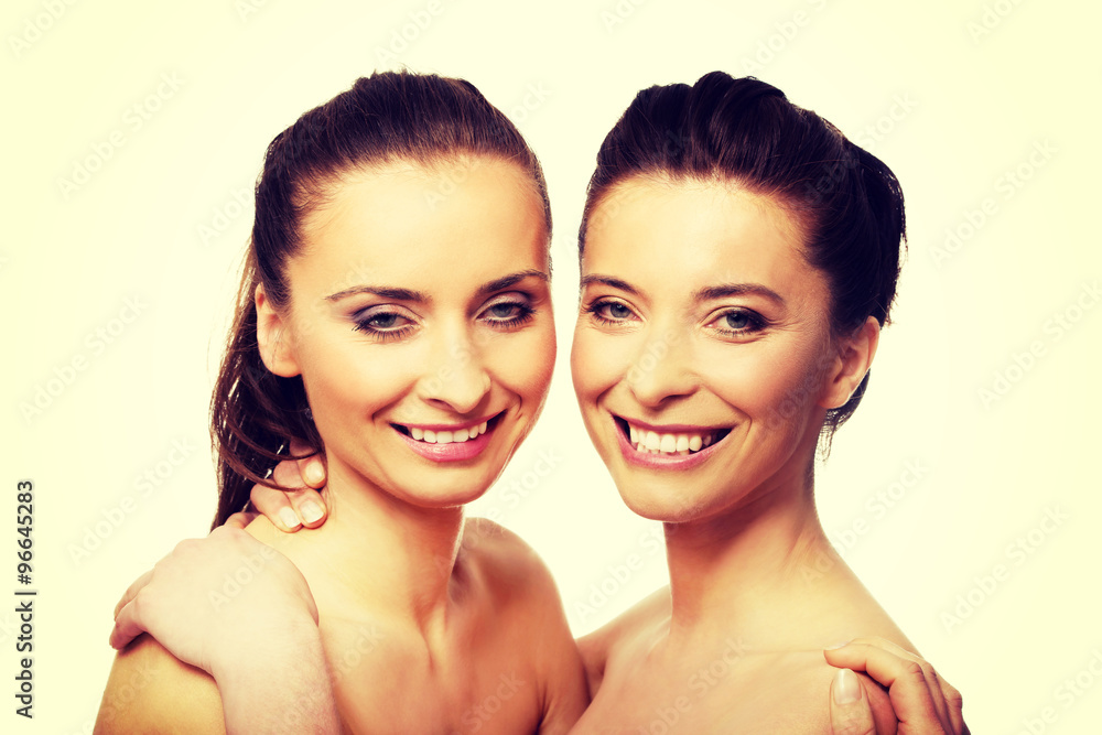 Two sisters with make up embracing. Two sisters with make up embracing.