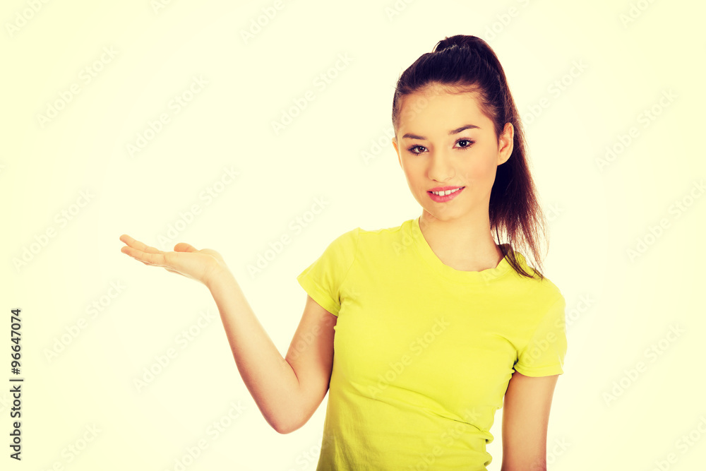 Woman holding something on palm. Woman holding something on palm.