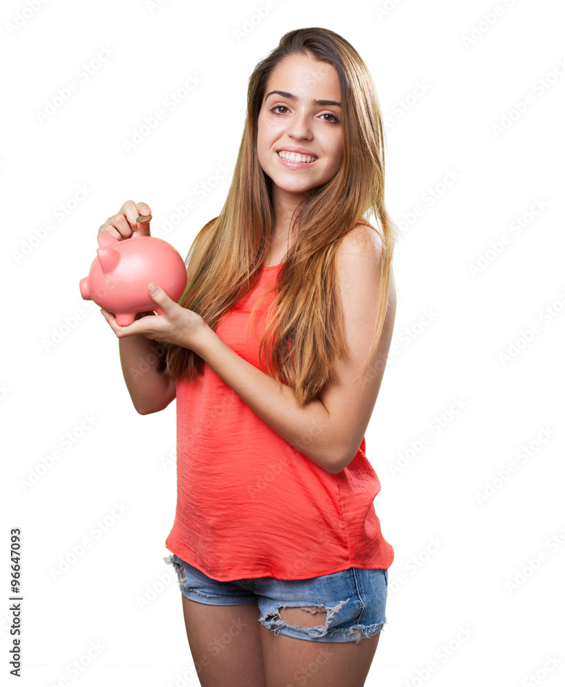 young cute woman saving with a piggy bank young cute woman saving with a piggy bank