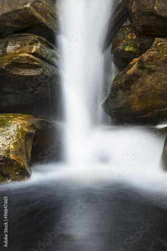 Fototapeta Naklejka Na Ścianę i Meble -  Silky long exposure of a waterfall in Kent Falls State Park, Connecticut.