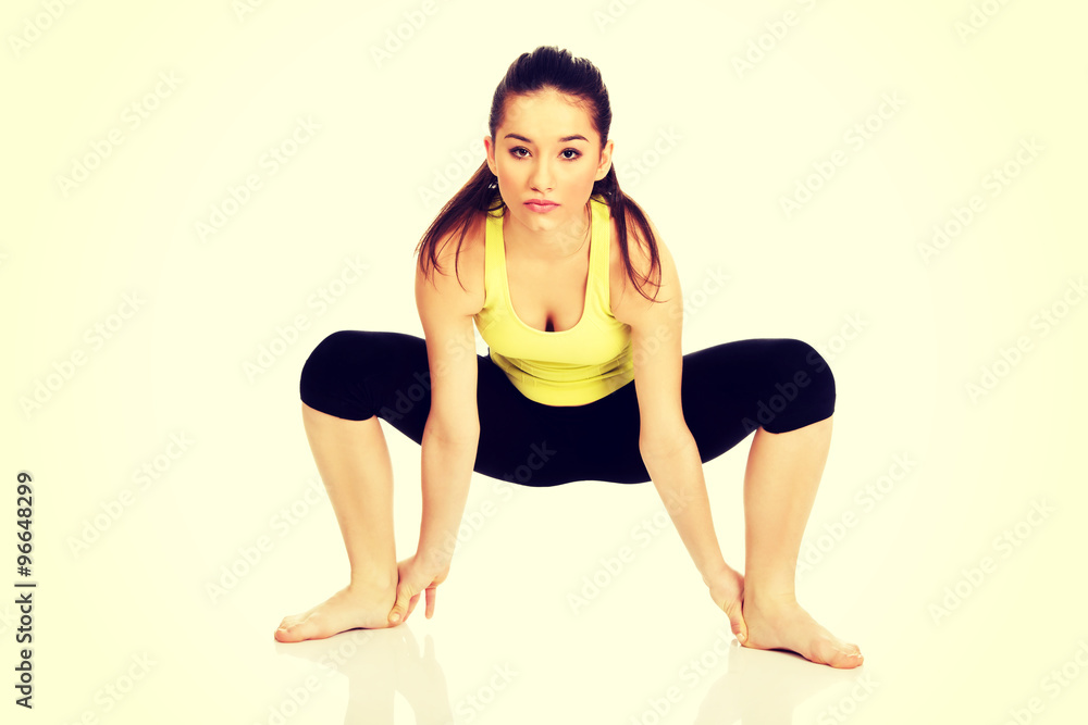 Fototapeta premium Woman doing stretching exercise.