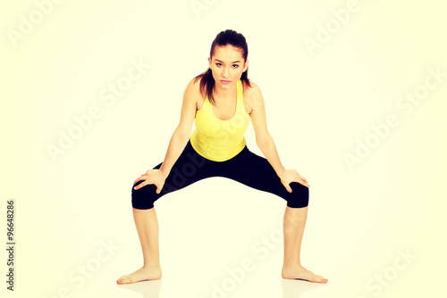 Young woman in warm up exercise.