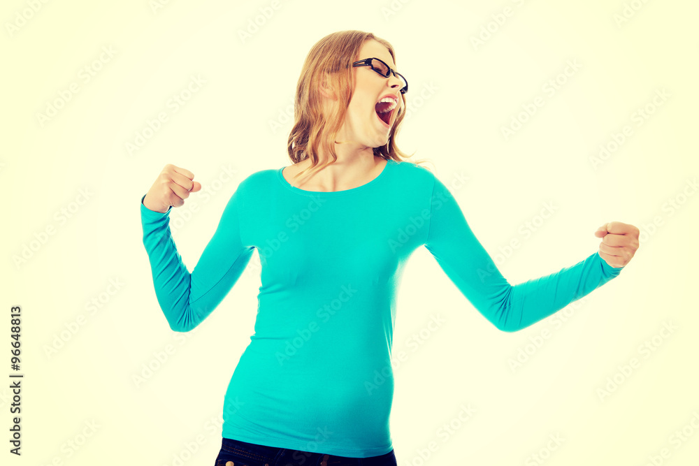 Angry teenage woman making fists Angry teenage woman making fists