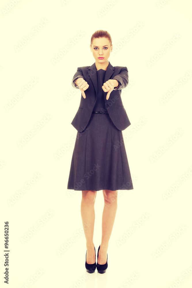 Business woman showing thumbs down. Business woman showing thumbs down.