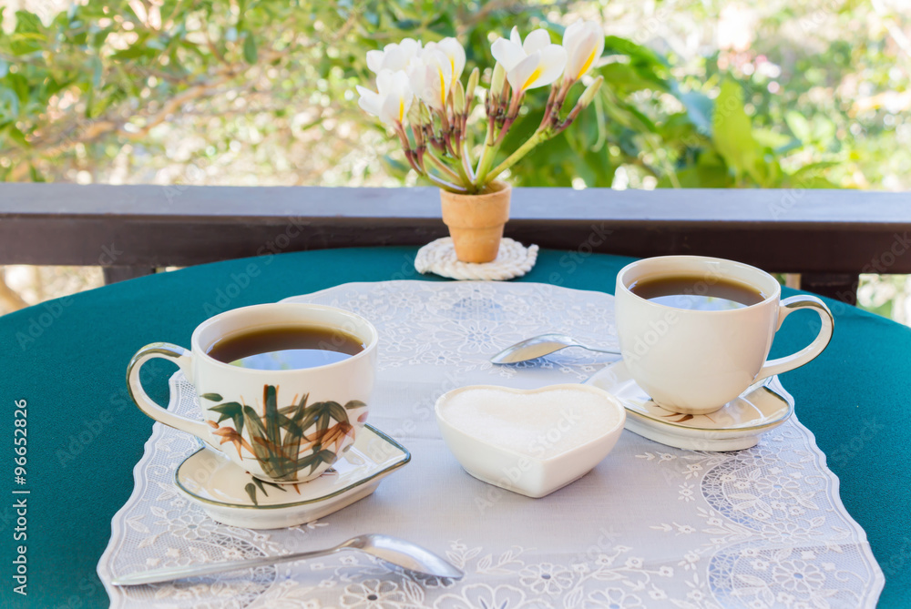 Relaxing time and happiness with two cups of black coffee with sugar Relaxing time and happiness with two cups of black coffee with sugar