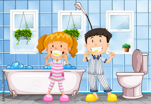 Boy and girl brushing teeth in the bathroom