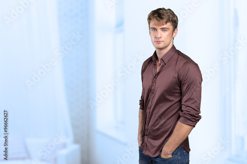 Portrait of handsome young thoughtful man