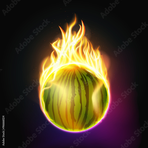 Burning watermelon on a dark background.