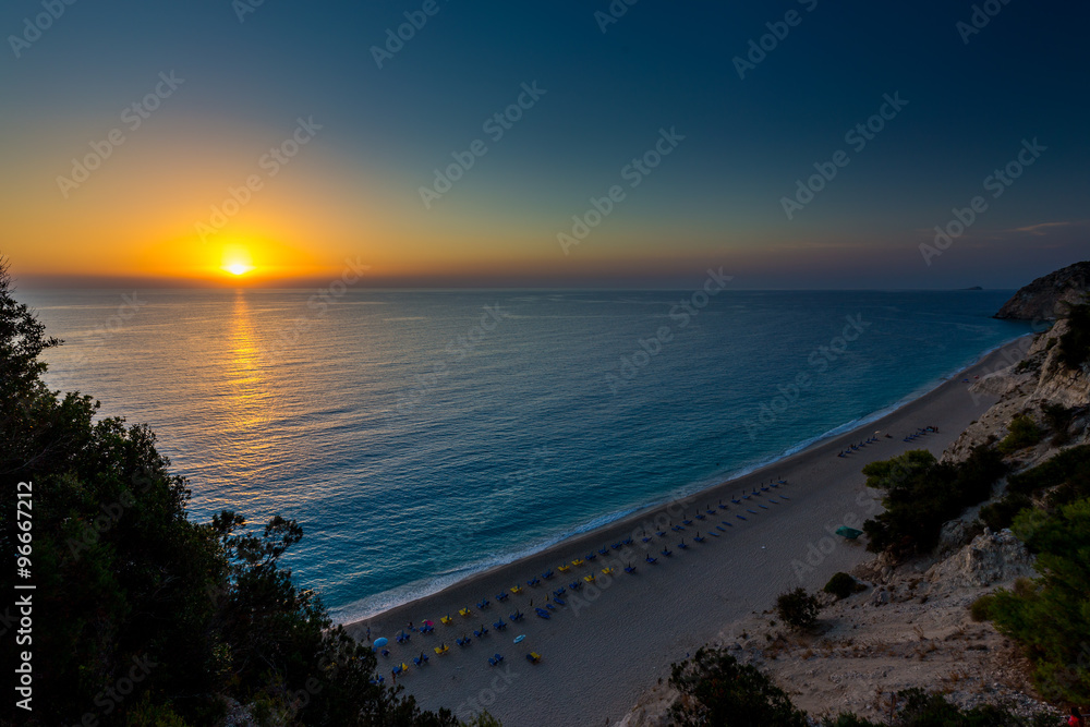 Egremni beach Lefkada at sunset / Beautiful summer white Egremni beach on Ionian Sea (Lefkada, Greece) summer view from nearest rock