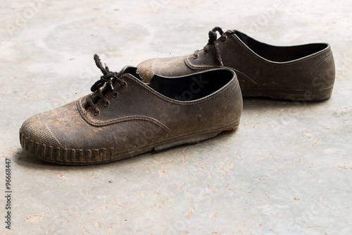 Old and dirty rrubber footwear