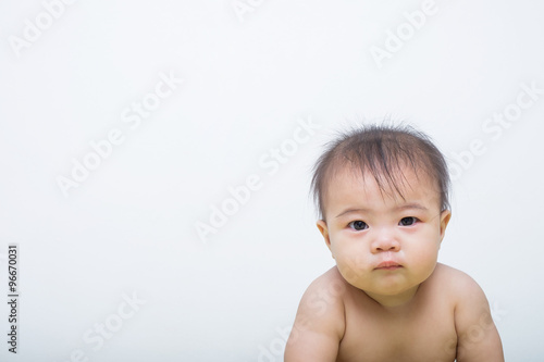 Portrait of a fever baby crying on background