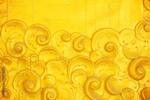 The gold stucco design of native thai style on the Wall
