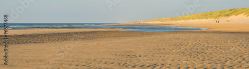 Fototapeta Naklejka Na Ścianę i Meble -  Sunlight over a beach along the North Sea
