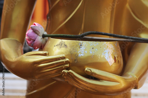 Bilde på lerret Buddha's Hands with a cup and a lotus flower - Thailand