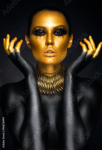 Beautiful woman portrait in gold and black colors