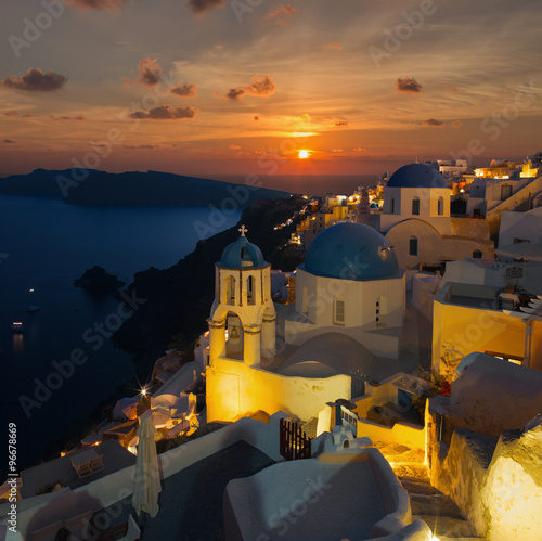 Santorini - The Oia at sunset and the Therasia island in the background.
