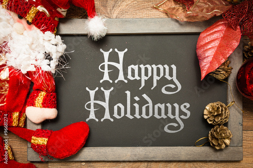 Blackboard with the text: Happy Holidays in a christmas conceptual image