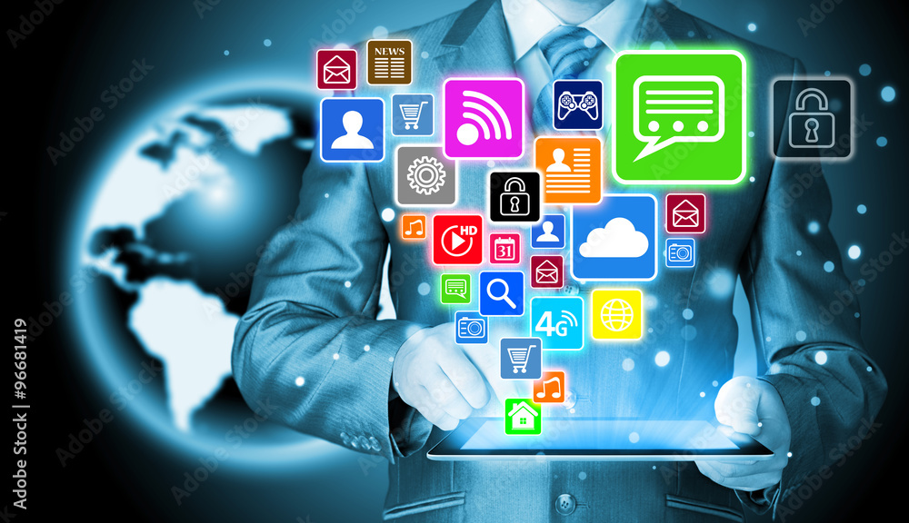 Obraz premium Business man using tablet PC with social media icon set