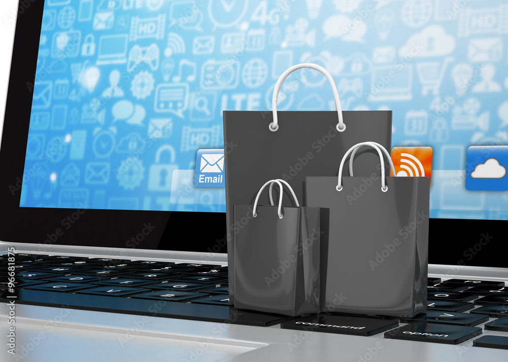 laptop and shopping pags on white background laptop and shopping pags on white background