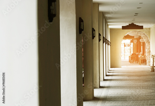 walkway with light from doors