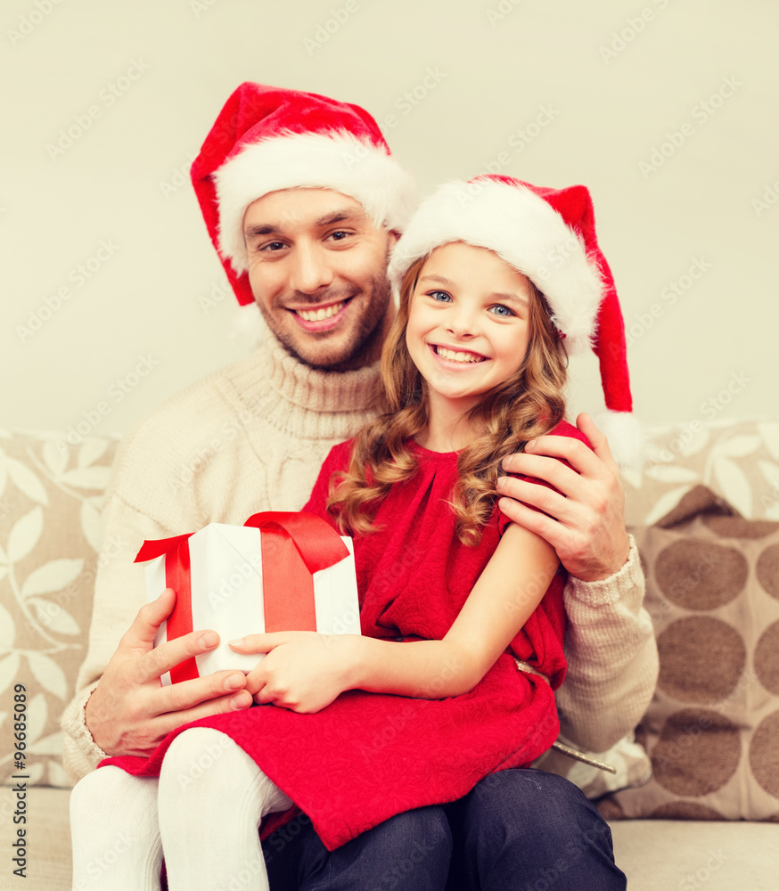 smiling father and daughter holding gift box smiling father and daughter holding gift box