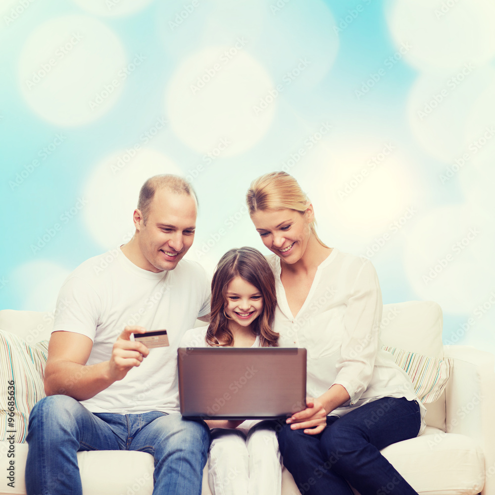 happy family with laptop computer and credit card happy family with laptop computer and credit card