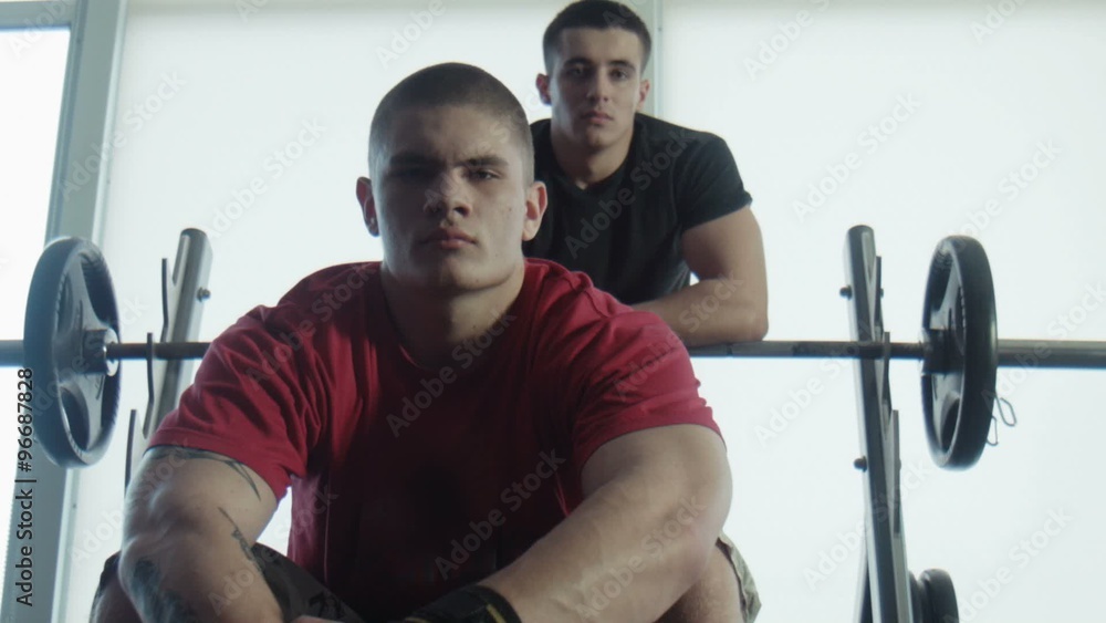 Two bodybuilders look in the camera Two bodybuilders look in the camera