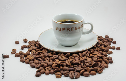 cup of coffee on coffee grains