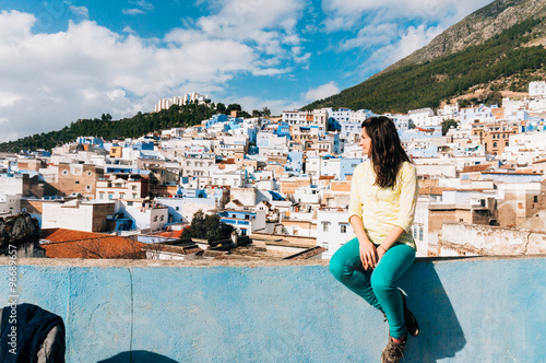 Female tourist looking at Chefchaouen - city of Morocco © ShutterDivision