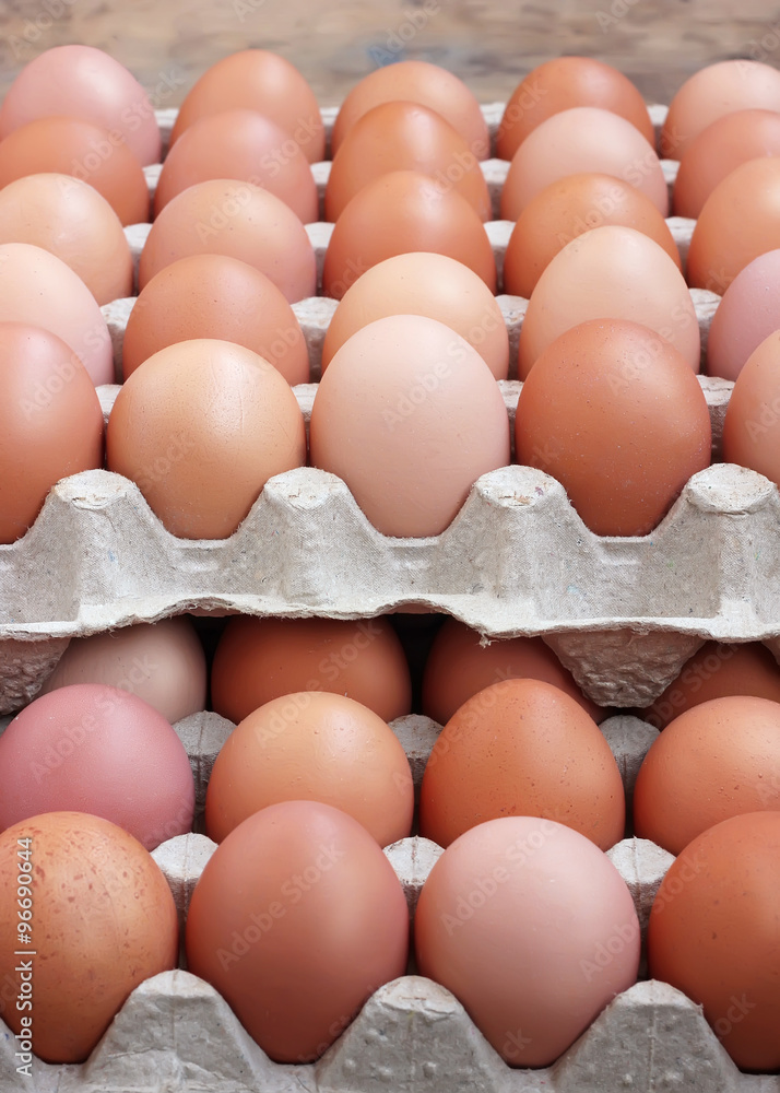 Chicken brown eggs in a tray. Food.