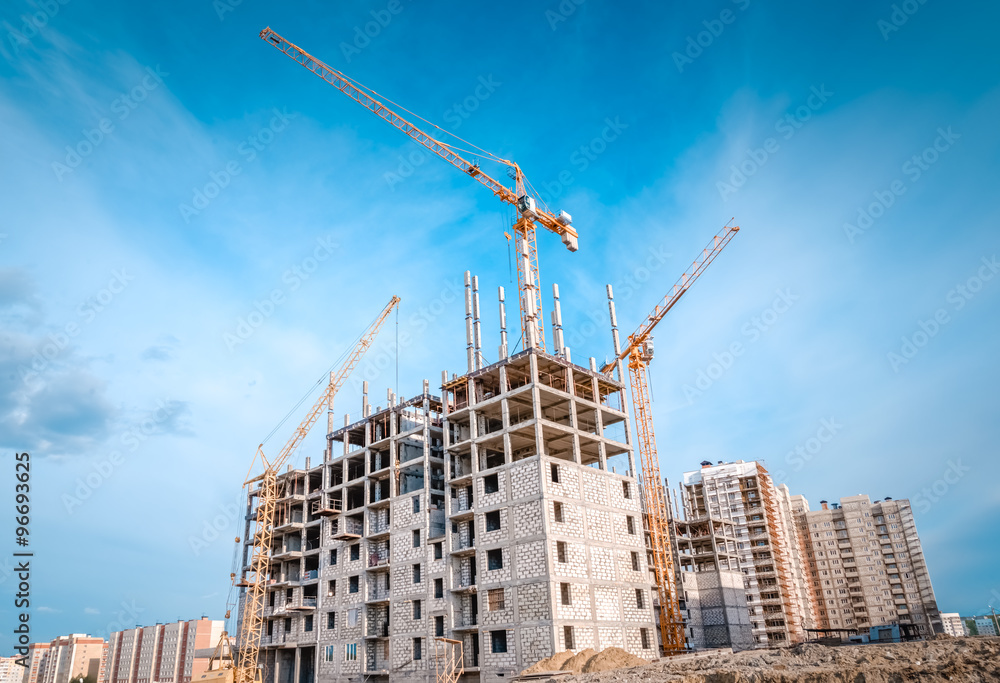 Building construction site and large crane Building construction site and large crane