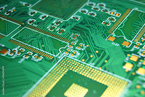 Printed circuit board closeup green electronic background