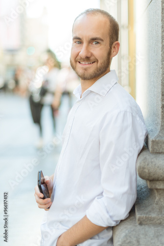 Smiling man with phone