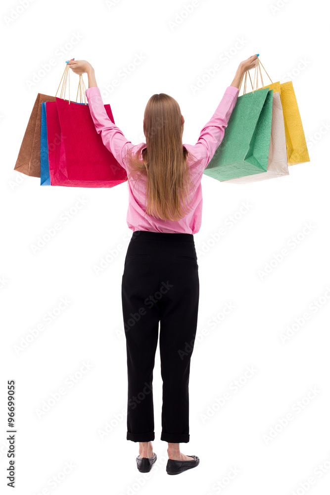 back view of woman with shopping bags . back view of woman with shopping bags .