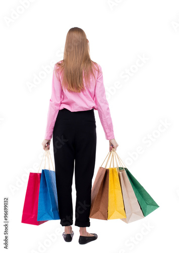 back view of woman with shopping bags .