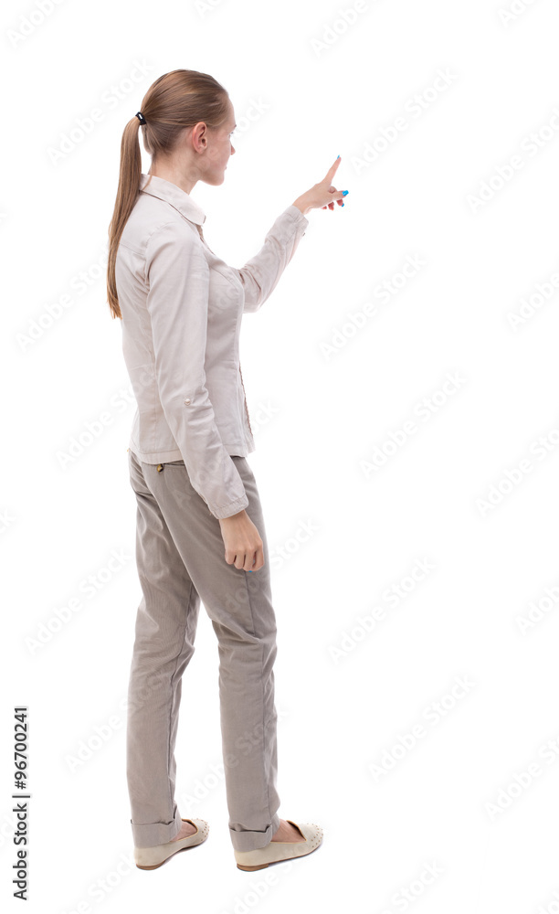 Back view of pointing woman. Back view of pointing woman.