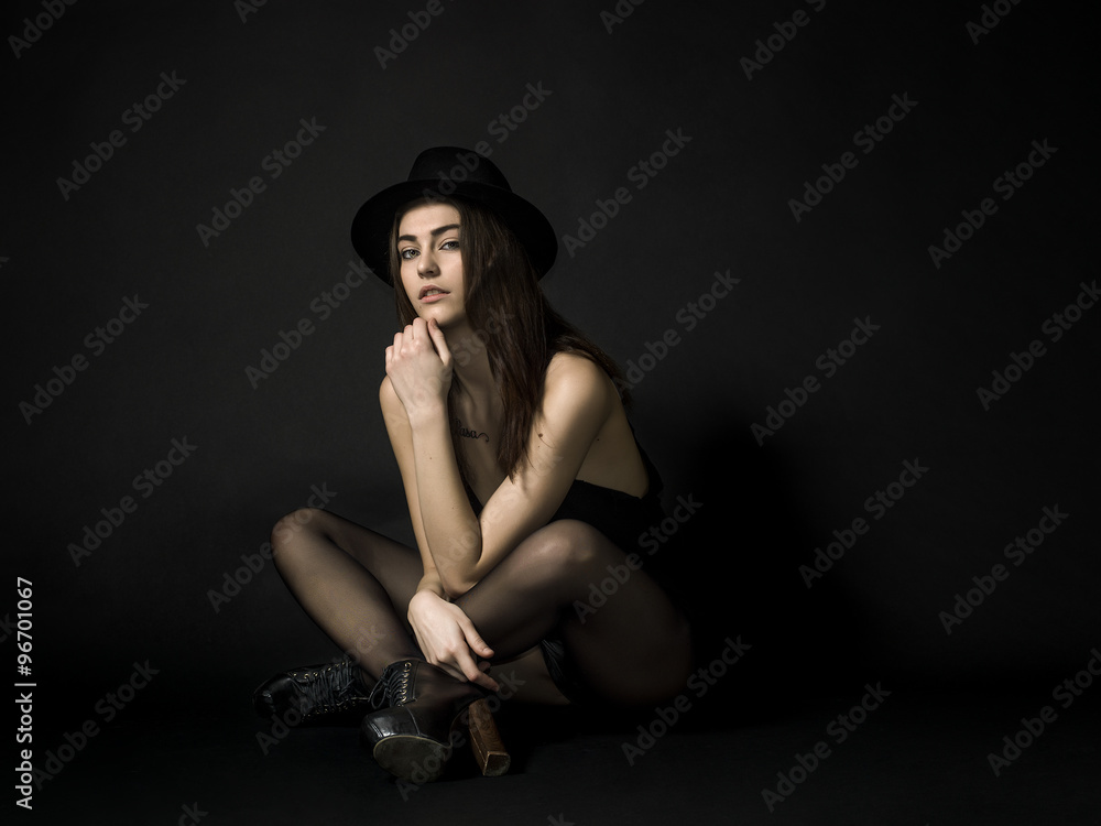 Beautiful rocker girl portrait wearing hat and looking Beautiful rocker girl portrait wearing hat and looking