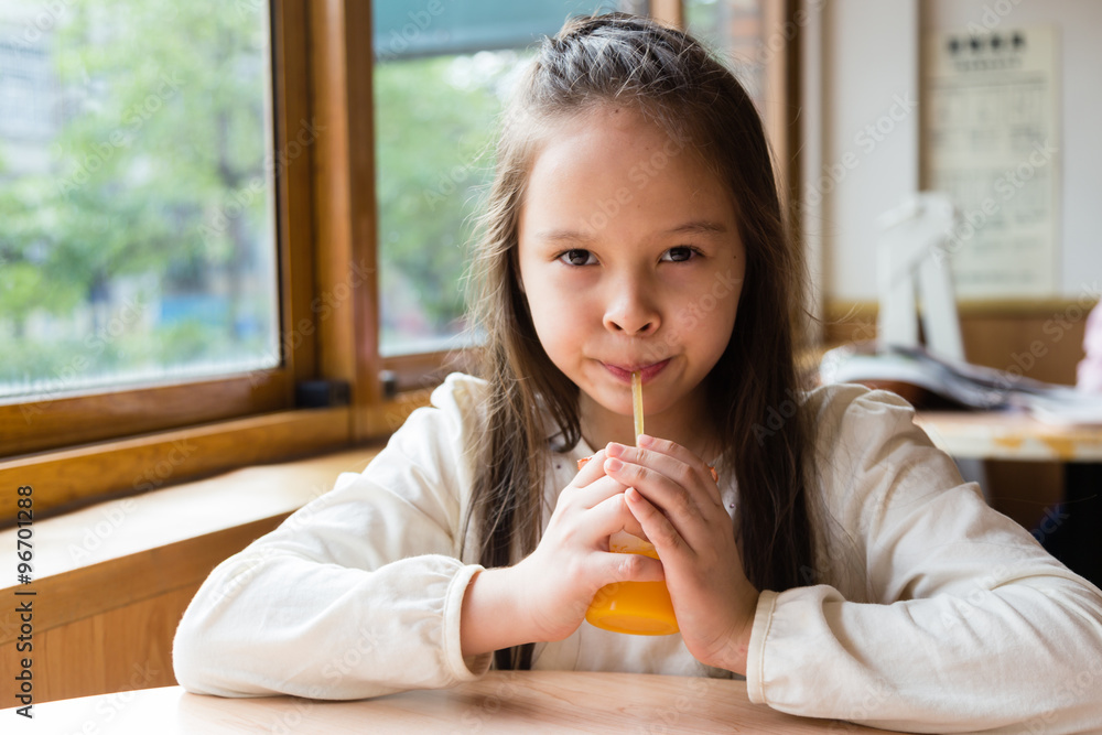 Multi-ethnic girl drinking juice Multi-ethnic girl drinking juice