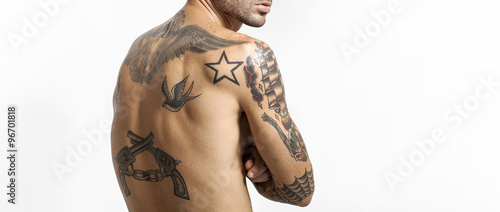 Sexy tattooed man back portrait looking at camera letterbox