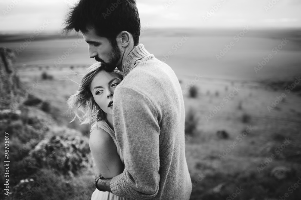 Passionate young couple in mountains Passionate young couple in mountains