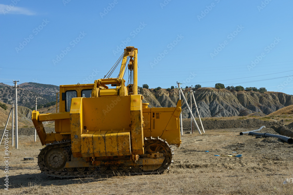 Obraz premium Pipe layer dozer is at pipeline building place.